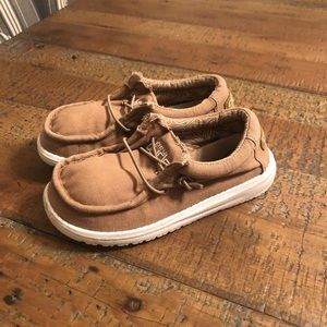 Boy’s slip-on Hey Dude canvas shoes.